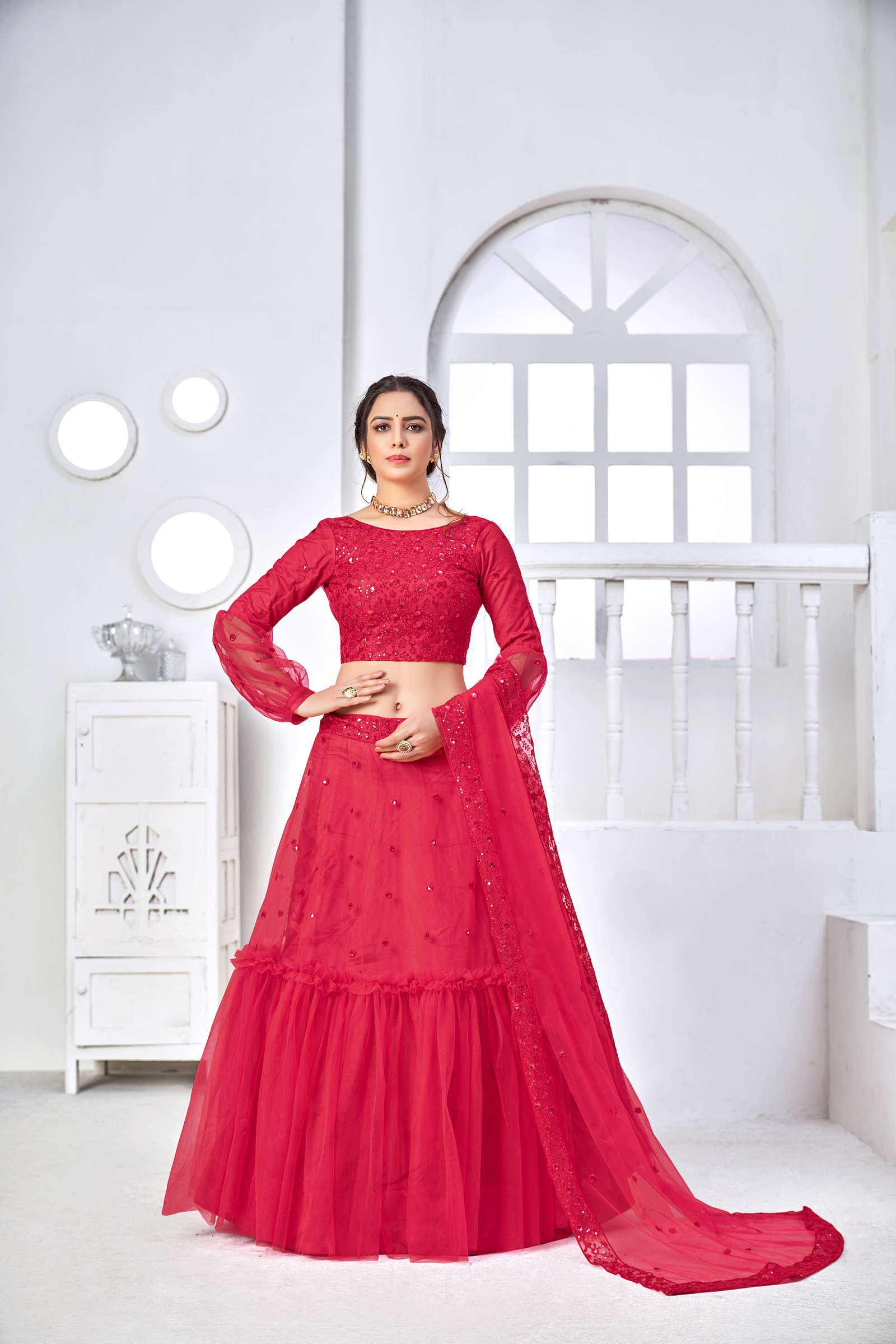 Adorable rani pink thread with sequins embroidered net party wear lehenga choli